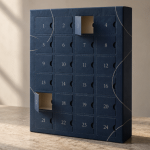 Illustrative concept of a custom 24-door paperboard advent calendar box in matte ink blue